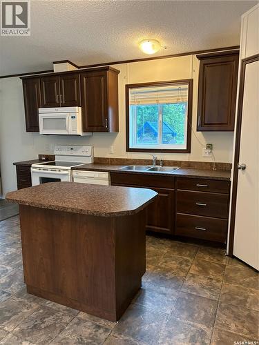 69 Railway Avenue, Calder, SK - Indoor Photo Showing Kitchen With Double Sink