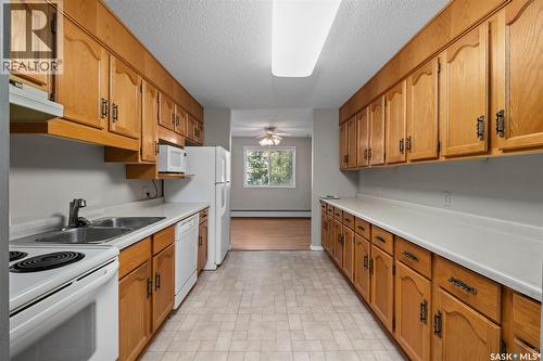 105 66 19Th Street W, Prince Albert, SK - Indoor Photo Showing Kitchen With Double Sink