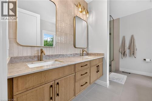 Dual vanity with natural wood-finish cabinetry and bronze-finish hardware - 67 Cielo Court, Hamilton, ON - Indoor Photo Showing Bathroom