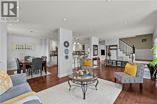 Recessed lighting illuminates wood-finish flooring throughout the open-concept space - 87 Monte Drive, Hamilton, ON - Indoor Photo Showing Living Room