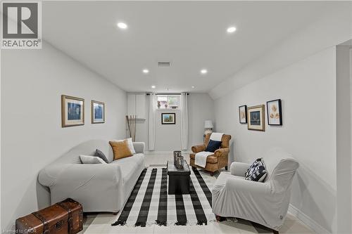 Recessed ceiling lighting, light gray wall finishes, light-toned flooring, and a window with white blinds - 87 Monte Drive, Hamilton, ON - Indoor Photo Showing Bedroom