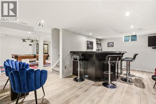 Wood-finish flooring, recessed lighting, built-in bar, and a dedicated billiards area - 536 Cusick Circle, Milton, ON - Indoor
