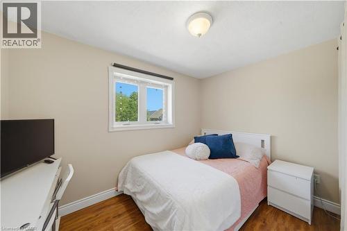 Bedroom with wood-finish flooring, neutral wall paint, and a white ceiling - 784 Butternut Avenue, Waterloo, ON - Indoor Photo Showing Bedroom
