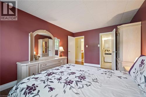 Hardwood-style flooring throughout, with a neutral ceiling - 6 Walton Avenue Unit# 107, Kitchener, ON - Indoor Photo Showing Bedroom