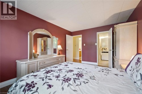 Hardwood-style flooring throughout, with a neutral ceiling - 6 Walton Avenue Unit# 107, Kitchener, ON - Indoor Photo Showing Bedroom