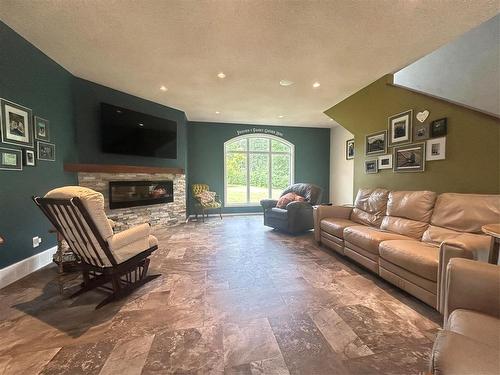155059 Pth 16 Highway, Foxwarren, MB - Indoor Photo Showing Living Room With Fireplace