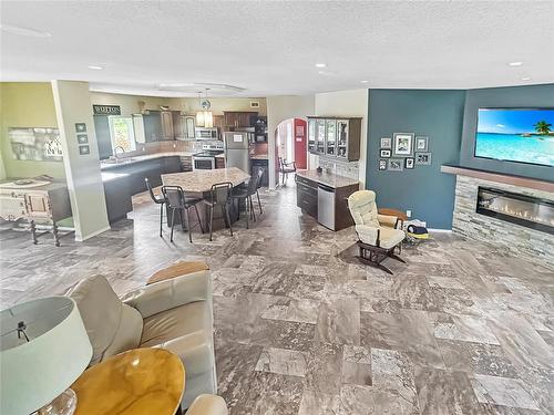 155059 Pth 16 Highway, Foxwarren, MB - Indoor Photo Showing Living Room With Fireplace