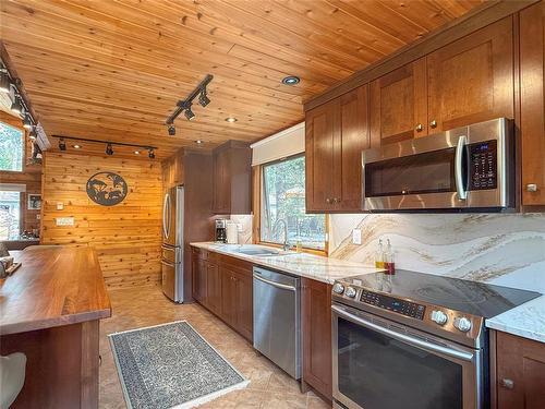 156 Crocus Street, Clear Lake, MB - Indoor Photo Showing Kitchen With Double Sink