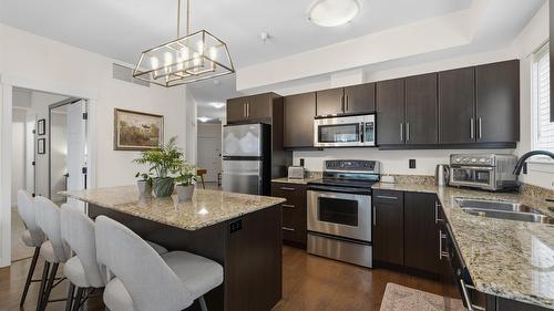 108-1957 Kane Road, Kelowna, BC - Indoor Photo Showing Kitchen With Stainless Steel Kitchen With Double Sink