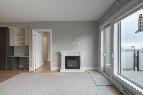 #302-2526 Bevan Ave, Sidney, BC - Indoor Photo Showing Living Room With Fireplace