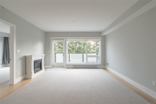 #302-2526 Bevan Ave, Sidney, BC - Indoor Photo Showing Other Room With Fireplace