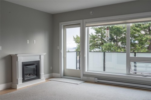 #302-2526 Bevan Ave, Sidney, BC - Indoor Photo Showing Other Room With Fireplace