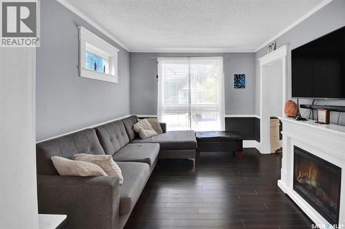 310 J Avenue N, Saskatoon, SK - Indoor Photo Showing Living Room With Fireplace