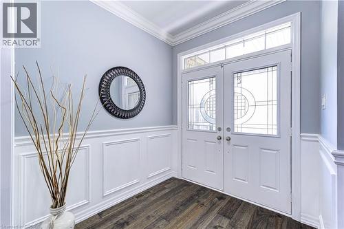 Entryway featuring white double doors with decorative glass panels and a transom window - 1406 Marshall Crescent, Milton, ON - Indoor Photo Showing Other Room