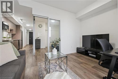 Open-concept living space with wood-finish flooring - 15 Wellington Street S Unit# 903, Kitchener, ON - Indoor Photo Showing Living Room