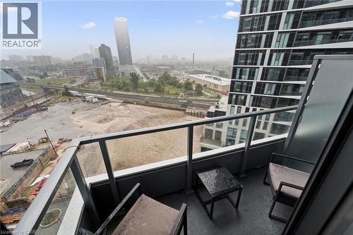 Private outdoor balcony with glass railing, providing an expansive urban vista - 15 Wellington Street S Unit# 903, Kitchener, ON - Outdoor With Balcony With View