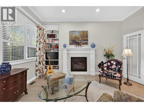 Family Room - 3901 Gallaghers Circle, Kelowna, BC - Indoor With Fireplace