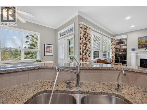 walk out from Kitchen and Family Room - 3901 Gallaghers Circle, Kelowna, BC - Indoor Photo Showing Kitchen With Double Sink