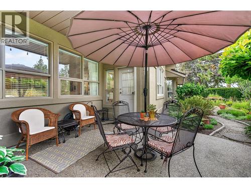 Back Patio - direct entry to Kitchen - 3901 Gallaghers Circle, Kelowna, BC - Outdoor With Deck Patio Veranda
