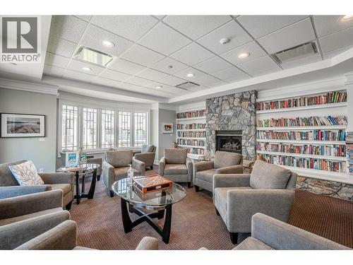 Library - 3901 Gallaghers Circle, Kelowna, BC - Indoor Photo Showing Living Room With Fireplace