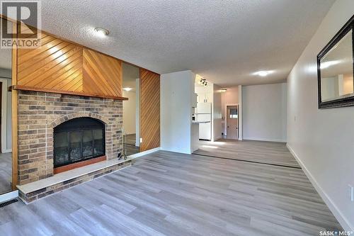 122 Edenwold Crescent, Regina, SK - Indoor Photo Showing Living Room With Fireplace