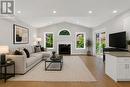 Photo is Virtually Staged - 3955 Foxwood Avenue, Mississauga, ON  - Indoor Photo Showing Living Room With Fireplace 