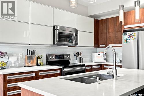 151 Tweed Lane, Saskatoon, SK - Indoor Photo Showing Kitchen With Stainless Steel Kitchen With Double Sink With Upgraded Kitchen
