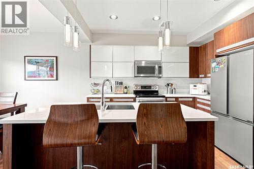 151 Tweed Lane, Saskatoon, SK - Indoor Photo Showing Kitchen With Stainless Steel Kitchen With Double Sink