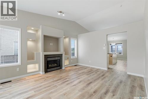 7323 Maple View Crescent, Regina, SK - Indoor Photo Showing Living Room With Fireplace