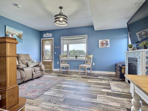35 Chemin Broussard, Petit Étang, NS - Indoor Photo Showing Living Room With Fireplace