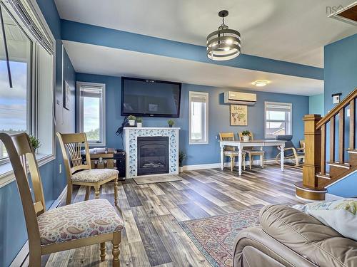 35 Chemin Broussard, Petit Étang, NS - Indoor Photo Showing Living Room With Fireplace
