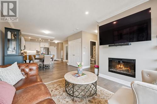 605 - 1878 Gordon Street, Guelph (Pineridge/Westminster Woods), ON - Indoor Photo Showing Living Room With Fireplace