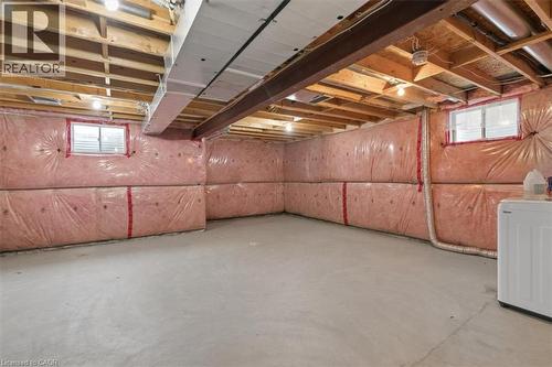 Concrete flooring with exposed ceiling joists and visible insulation - 242 Moorlands Crescent, Kitchener, ON - Indoor Photo Showing Basement