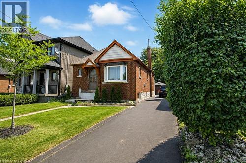 Driveway Blacktop recently done. - 35 Barons Avenue S, Hamilton, ON - Outdoor With Facade
