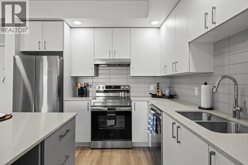 Photos are of a similar home; some features may vary - 1057 Frost Road Unit# 412, Kelowna, BC - Indoor Photo Showing Kitchen With Stainless Steel Kitchen With Double Sink With Upgraded Kitchen