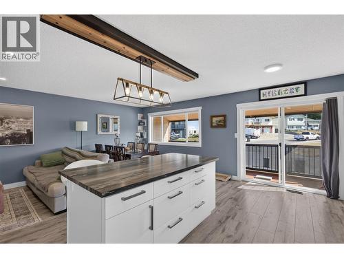 Generous kitchen island offers extra prep space and seating. - 3703 Commonage Crescent, Vernon, BC - Indoor