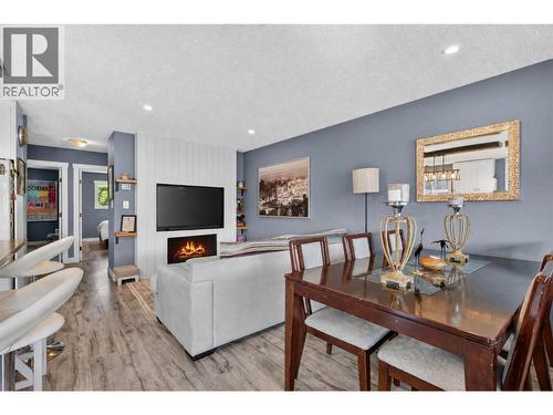 Bright dining area conveniently located beside the kitchen and living room. - 3703 Commonage Crescent, Vernon, BC - Indoor With Fireplace