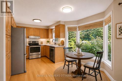 Kitchen and Eating Area - Virtually Staged - 28 Weybridge Drive, Ottawa, ON - Indoor