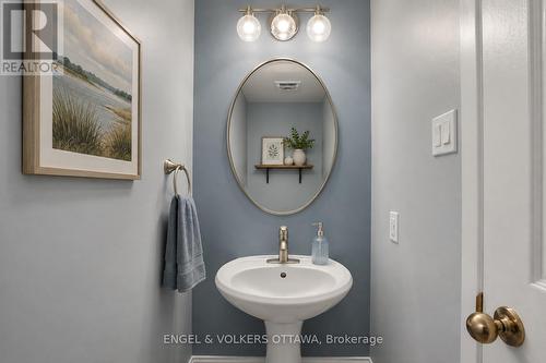 Main Floor Powder Room - Virtually Staged - 28 Weybridge Drive, Ottawa, ON - Indoor Photo Showing Bathroom