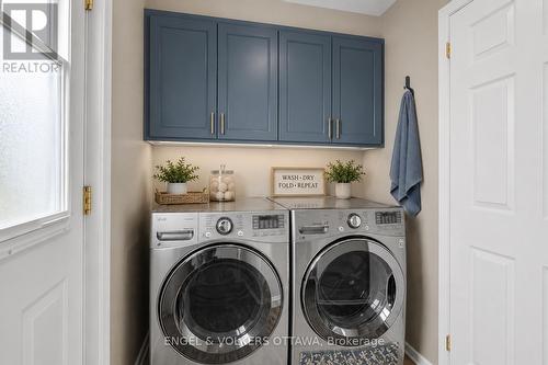 Main Floor Laundry Room - Virtually Staged - 28 Weybridge Drive, Ottawa, ON - Indoor Photo Showing Laundry Room