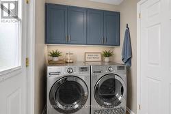 Main Floor Laundry Room - Virtually Staged - 
