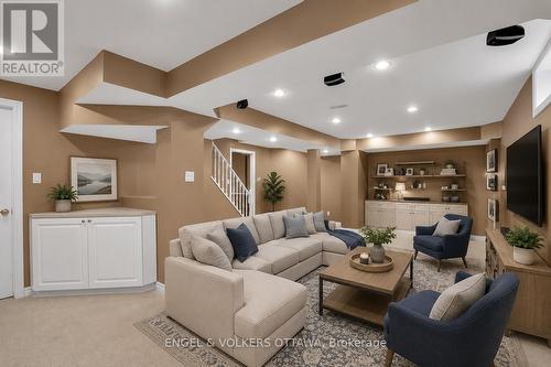 Lower Level Recreation Room - Virtually Staged - 28 Weybridge Drive, Ottawa, ON - Indoor