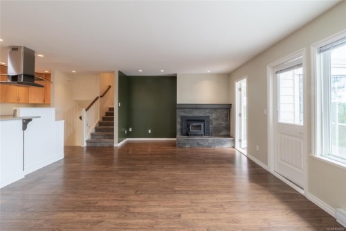 253/255 Heddle Ave, View Royal, BC - Indoor Photo Showing Living Room With Fireplace
