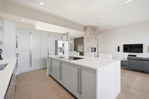 8 Orchard Gate, Oak Bluff, MB - Indoor Photo Showing Kitchen With Fireplace With Upgraded Kitchen