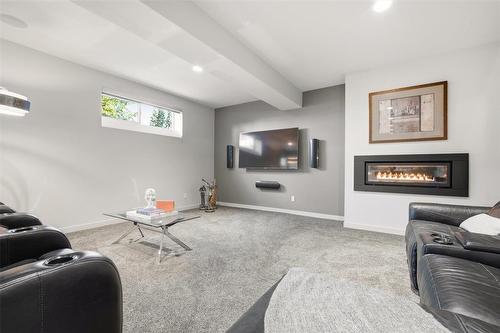 8 Orchard Gate, Oak Bluff, MB - Indoor Photo Showing Living Room With Fireplace