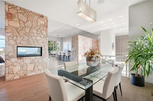 8 Orchard Gate, Oak Bluff, MB - Indoor Photo Showing Dining Room With Fireplace