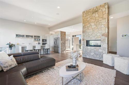 8 Orchard Gate, Oak Bluff, MB - Indoor Photo Showing Living Room With Fireplace