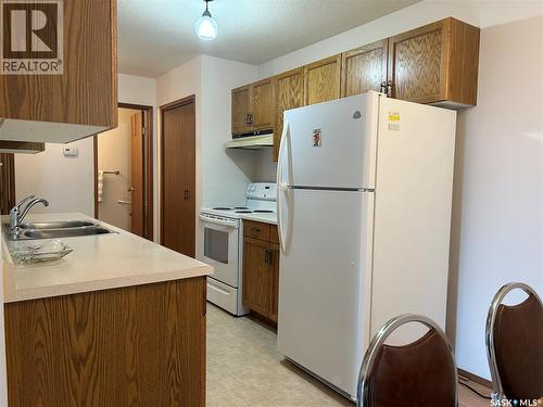 4 416 Heritage Drive, Estevan, SK - Indoor Photo Showing Kitchen With Double Sink