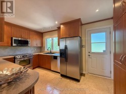 Kitchen has a patio door and upgraded Cabinets - 