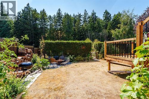 Tall hedge and gate access to serene Trillium Park - 4105 Ross Rd, Nanaimo, BC - Outdoor